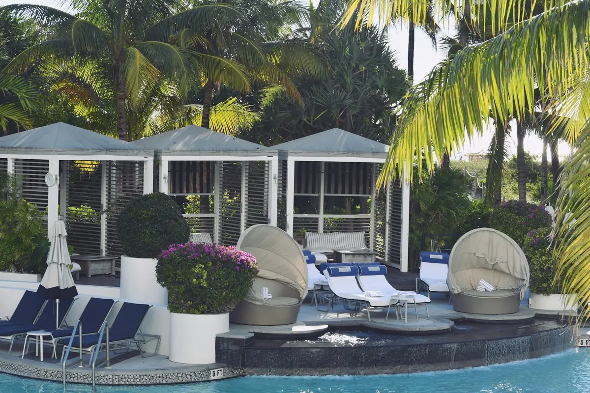 Poolside daybeds and cabanas at a beach club