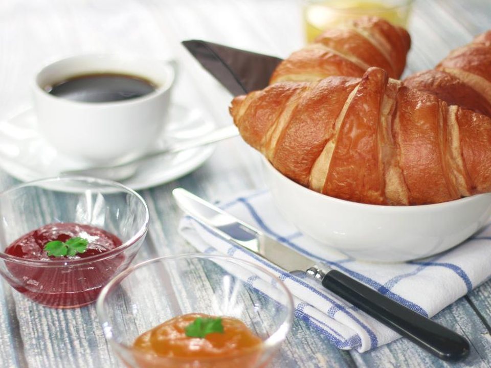 Coffee and fresh croissants on a café table